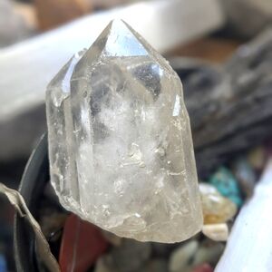 Clear quartz crystal with imperfections